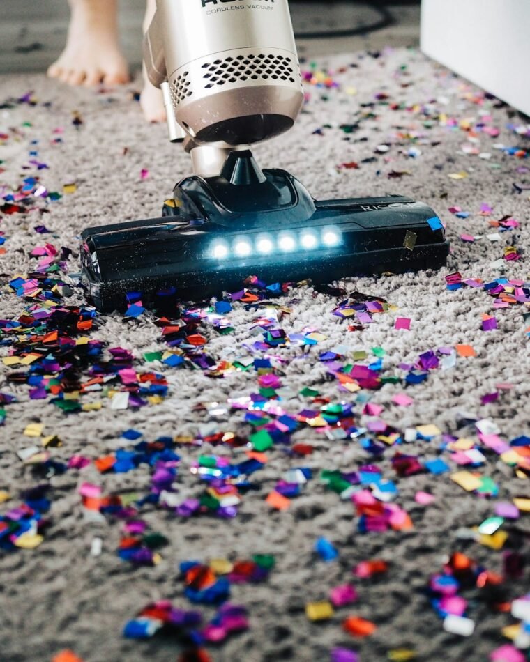 Carpet cleaning technician deep cleaning a carpet with professional hot water extraction equipment