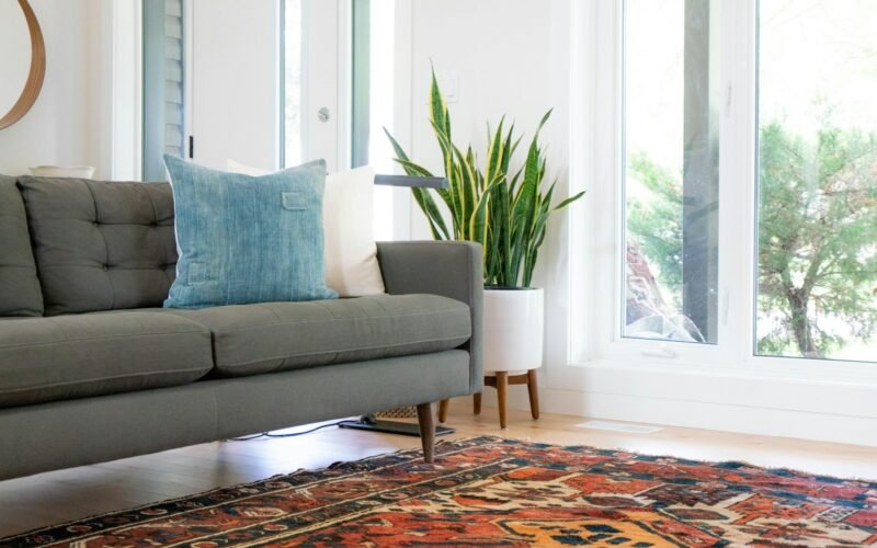 Fabric sofa and area rug cleaned and restored in a living room