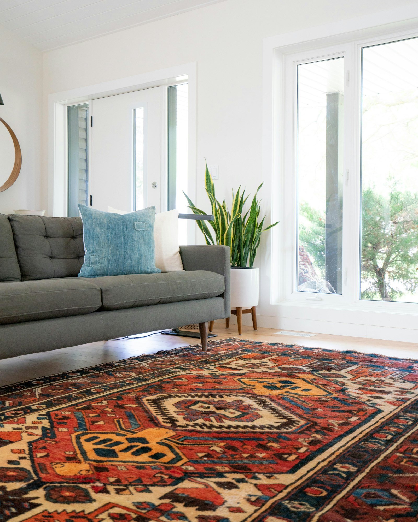 Fabric sofa and area rug cleaned and restored in a living room