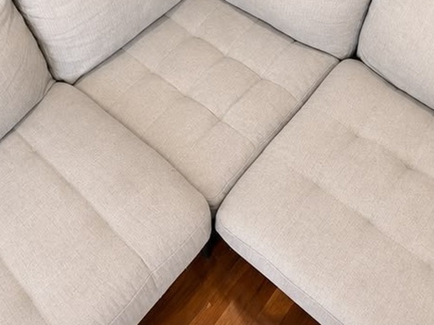Fabric corner lounge, seat and back cushions. After cleaning by Horizon Solutions Group.